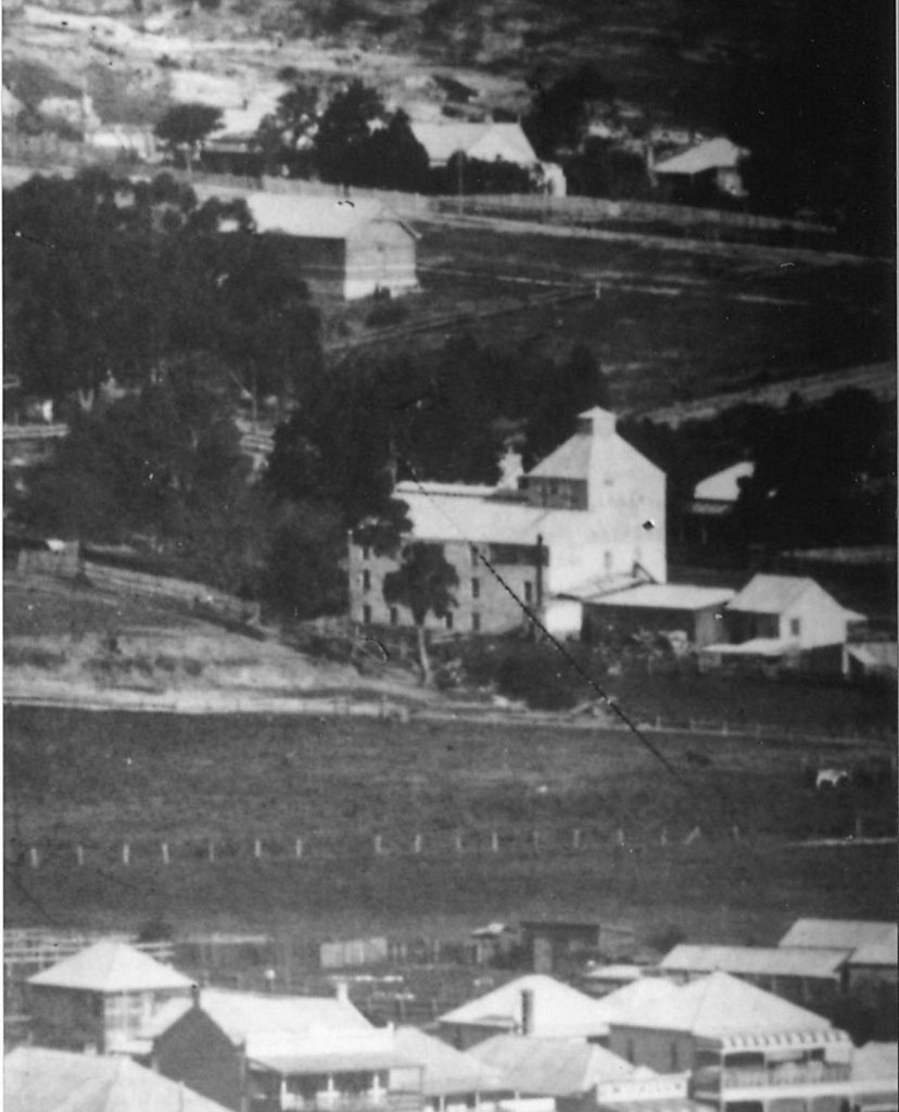 The restored brewery building with cast-iron lacework verandah